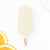 Orange cream frozen pop from The JoyPop Co on a white background with slices of orange on the sides